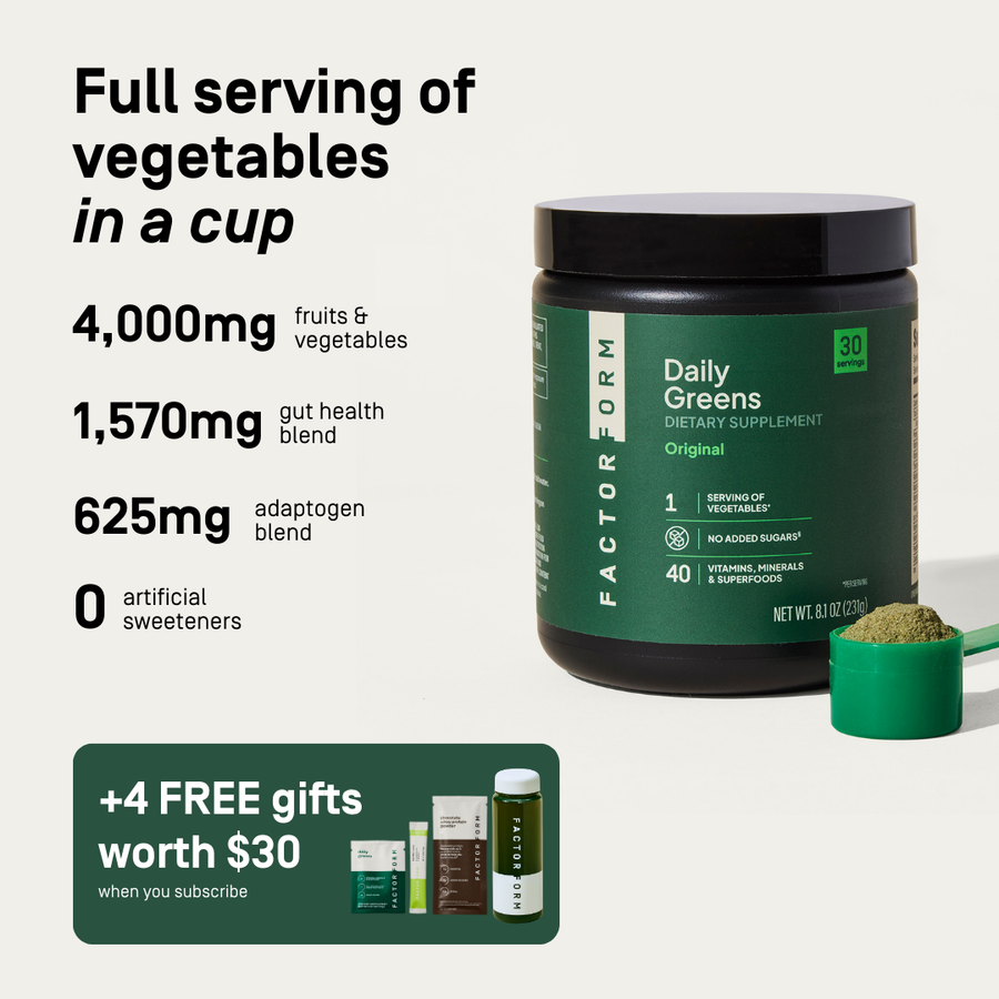 Green supplement container labeled 'Daily Greens' with text about nutritional benefits. Full serving of vegetable in a cup. 4000mg fruits & vegetables, 1570mg gut health blend. 625mg adaptogen blend. 0 artificial sweeteners.