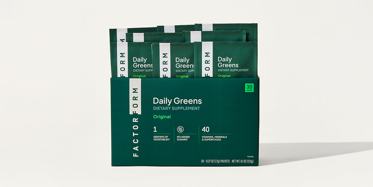 Package of Factor Form Daily Greens dietary supplement on a white background